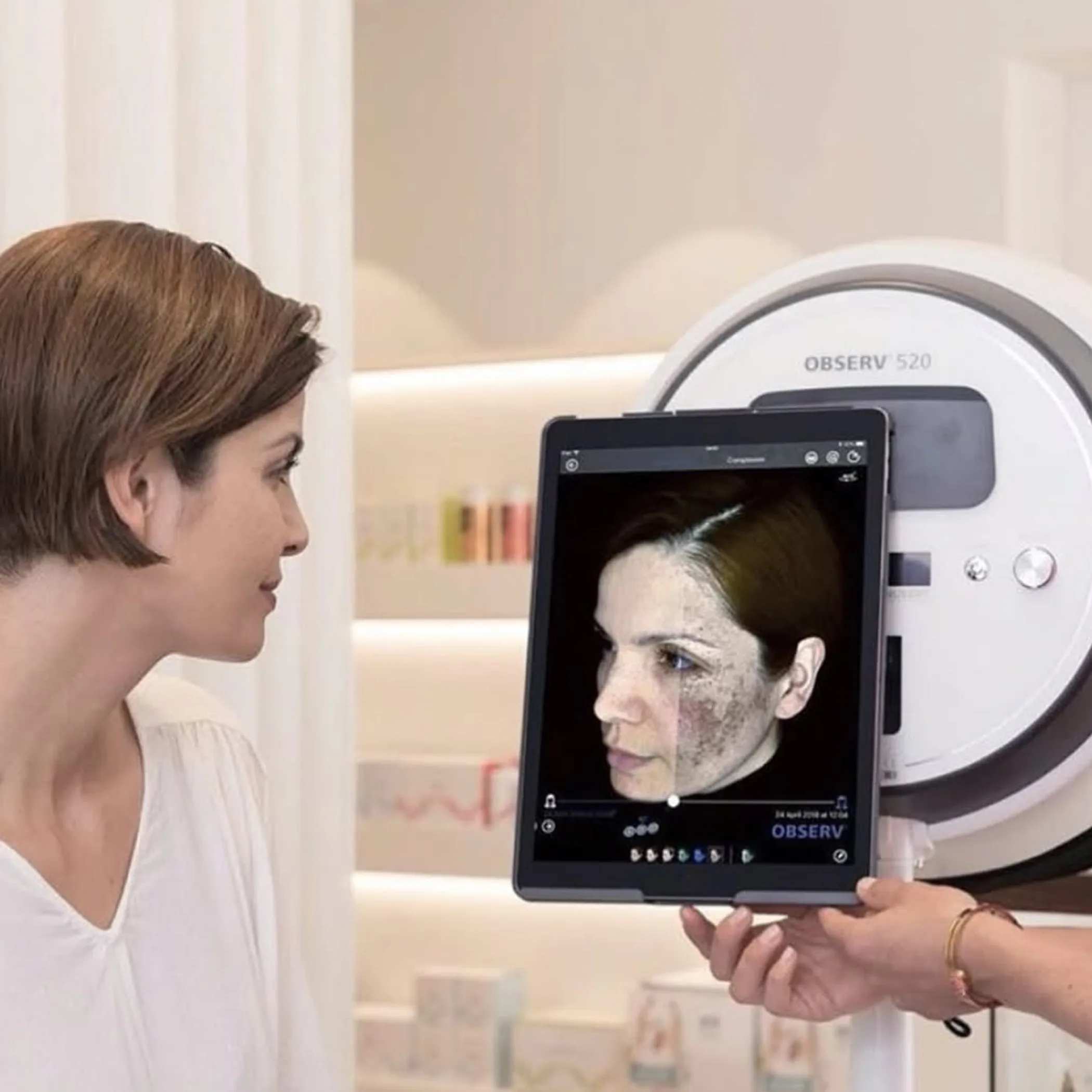 woman receiving facial skin analysis