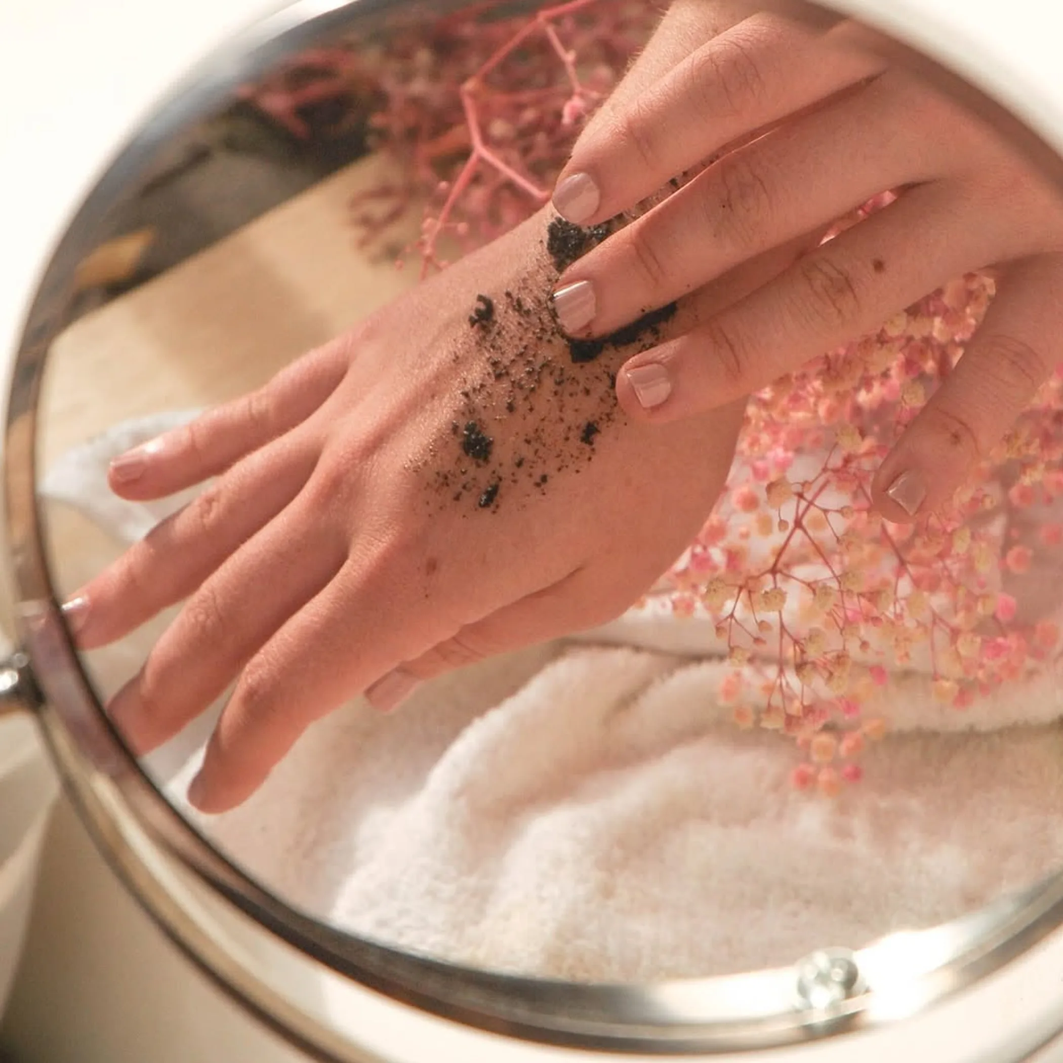 applying diy coffee body scrub